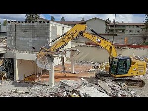 Demolishing a Bank Vault And Caving In The Basement Using a 323 Caterpillar Excavator