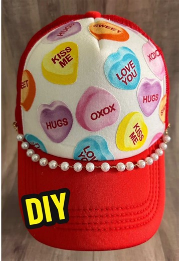 DIY Valentine Trucker Hat! I’m still loving this candy heart fabric! Using Fabric Mod Podge to decoupage / glue the fabric to the hat! So easy and so 🩷 cute! 🩷 #diyfashion #crafts #tutorials