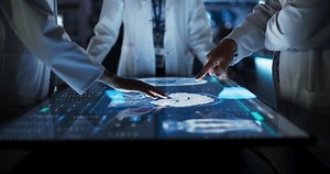 Hospital Medical Research Center: Focus On Hand Gestures Of Diverse Colleagues Gathered Around Interactive Touch Screen Table With MRI Scans Of Brain On Display. Doctors Looking For Alzheimer's Cure.