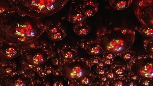 Festive red disco balls creating a warm and inviting atmosphere for celebrations, reflecting vibrant lights. Part of series Disco Balls Illuminated.