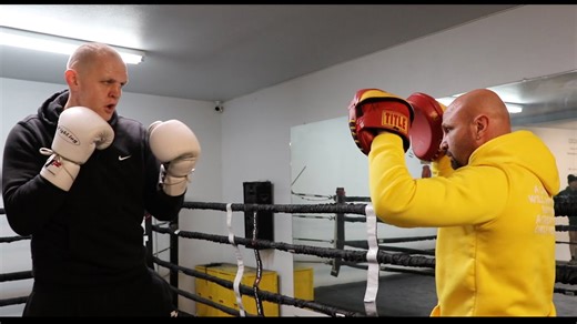 Skylar Lacy & coach Bones Adams staying sharp with a pad work drill at Bones Adams gym