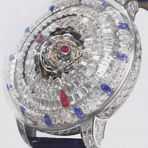 Magic or mystery? Putting two triple-axis tourbillons in the center of the @jacobandco Mystery Tourbillon was challenging, as is powering the two hexagonal-diamond-set disks. The single rubies act as hour and minute markers. | Jacob & Co.