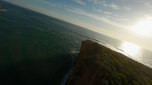Rocks and a sandy cliff by the ocean in Australia
