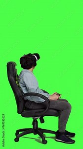 Profile Woman playing video games on console with controller and vr headset, sitting against greenscreen backdrop. Gamer having fun with online tournament, virtual reality interactive cyberspace