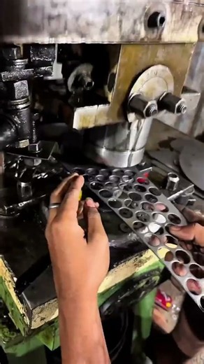 Industrial Punch Press Making Precise Holes in Sheet Material