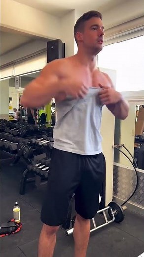 young muscle guy flexing his physique