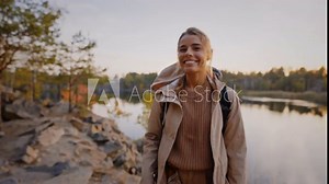 Young lady smiling and giving high five by canyon Stock Video