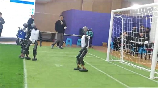 Robots play football against each other in China