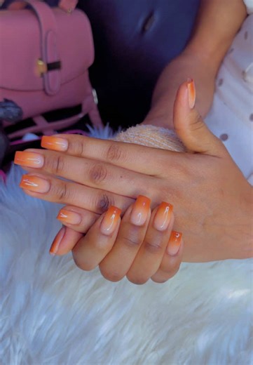 ✨💅 My new orange ombre nails are on 🔥! The gradient goes from soft peach to bold orange, giving me that fresh, sun‑kissed vibe every time I flash my fingertips. I’m loving the glossy finish and the perfect square shape that makes my hands look luxe AF. This nail art is the ultimate mood booster—perfect for brunch, parties, or just flexing my style on the daily. Can’t get enough of this vibrant, eye‑catching look that screams confidence & creativity! 💖💋 #OmbreNails #OrangeNails #NailArt #Nail