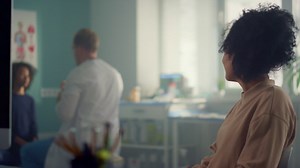 Doctor pediatrician conduct general medical checkup teen girl in modern clinic. Free Stock Video Footage