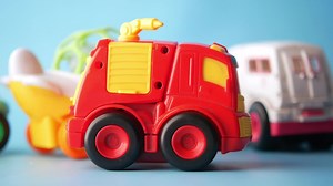 a group of toy trucks on a blue background