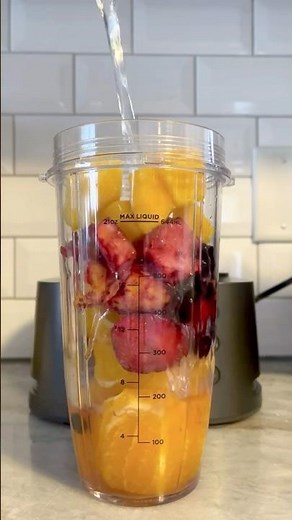 tasty fruit smoothie with fresh oranges and frozen mango, strawberry, and blueberries! 🍊🥭🍓🫐