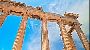 Parthenon restored landmark temple ruins on archaeological site with iconic Doric columns in Greece. Ancient Ionic temple depicting goddess Athena with 4 monolithic columns and decorated marble slabs.