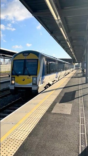 TRANSLINK TRAIN arriving at BELFAST GRAND CENTRA IN STATION in NORTHERN IRELAND