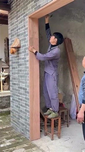 A man installed doors and windows with old woods in his old house which he bought