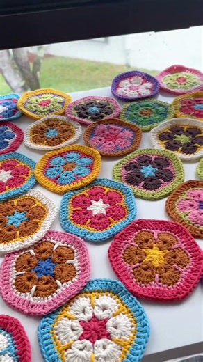 Working under new African flower blouse.The hexagon motif tutorial on my youtube channel.