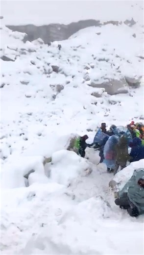 A line of trekkers making their way through fresh snow after a heavy snowfall at Chola pass 5420m. | Incredible Treks and Tours