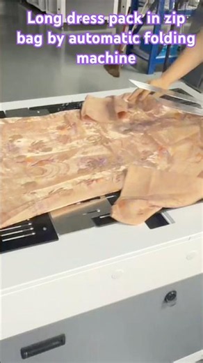 Still fold dress by hand? Look at this folding machine #automatic #machine #apparel #smallbusiness