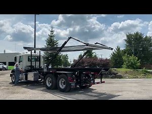Roll-off Top Skid Truck with Pioneer Canvas System in action – DRC-6022-TS model