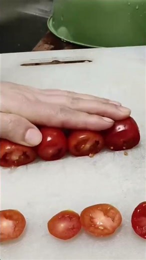 the process of cutting several tomatoes using a knife into several pieces#creative