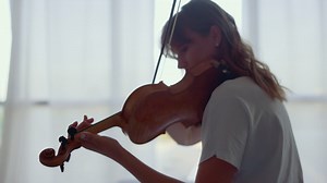 Free stock video - Woman practicing music on violin