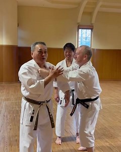 Continuation of Gima Sensei's Tensho lesson. Tensho includes techniques where you don’t resist the opponent but instead close the distance, matching their movements. When the opponent relaxes after finishing their attack, you strike their vital points. #karate #martialarts #okinawa #japan #gojuryu | Visit Karate Okinawa -produced by Ageshio Japan Co.,Ltd（アゲシオジャパン株式会社）