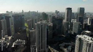 Epic View of Manila Skyline. Sunrise. Flying Above Bonifacio Global City, Taguig, Philippines.