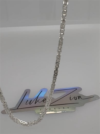 2mm Byzantine Chain at 26 Inches | Long, Detailed Sterling Silver Chain This close-up showcases a 2mm Byzantine chain at 26 inches, filmed in a light box to highlight its intricate construction across a longer length. The 26-inch length allows the fine Byzantine weave to extend and flow naturally, while the 2mm width keeps the chain lightweight and refined. Crafted from solid 925 sterling silver and made in Italy, this chain emphasizes detail over bulk. Find more lengths and styles at LukeZionJe