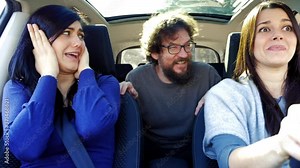 Happy people making funny faces and joking while driving car Stock Video