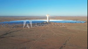 Fly toward Khi Solar One concentrated solar power plant in vast Kalahari landscape