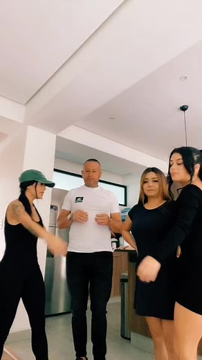 Coordinated Dance Routine in Family Kitchen