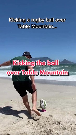 Kicking a Rugby Ball Over Table Mountain