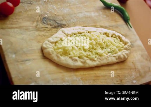 Shaped cheese pide ready for oven Stock Video Footage - Alamy