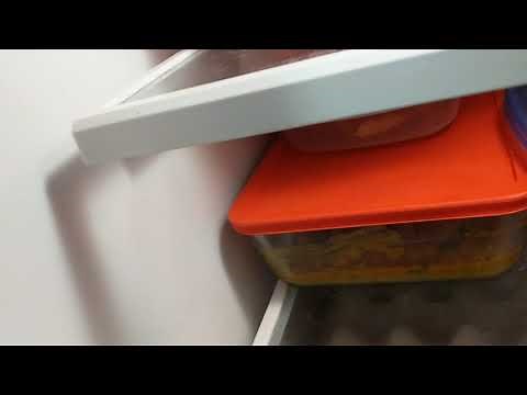 KitchenAid refrigerator with water dispenser that gets stuck on. how to fix