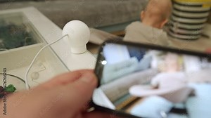 Home security camera works in living room, indoor security camera uses for surveillance and baby monitor with live stream direct to mobile phone. High quality 4k footage