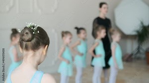 Young girls from ballet dancing ballet in white studio. Pretty graceful ballerinas doing elements of classical ballet - arts concept 4k footage Stock Video