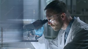 Scientist wearing safety goggles, gloves and lab coat, placing glass with sample under microscope and examining it in laboratory. Side view