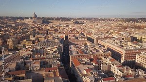 Aerial Cinematic drone downtown Piazza Rome Italy birds flying past buildings, cars, traffic and streets of Vatican City St Peters Europe Sistine Chapel square morning left slowly movement