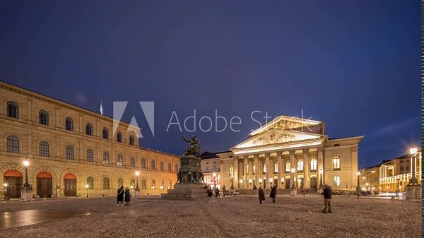 Munich National Theatre or Nationaltheater on the Max Joseph square day to night transition timelapse. Historic opera house, home of the Bavarian State Opera. The statue in the center. Germany
