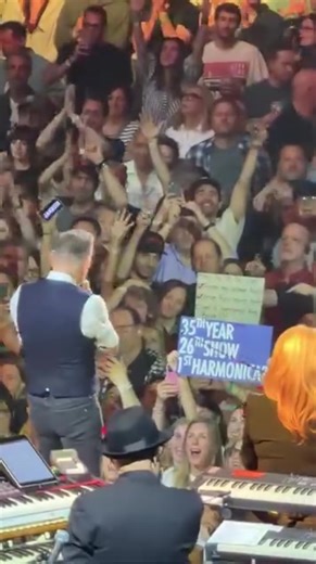 Bruce Springsteen Hands Out Harmonicas in NYC