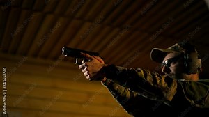 close up at a professional shooting range a military trainer reloading a pistol ready to shoot make shoot