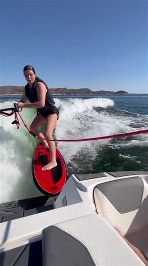 Woman Falls Into Water After Wakeboard Catches on Boat