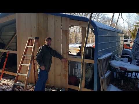 Installing / building a wood wall on the back of a metal carport.