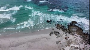 South Africa aerial cinematic drone surf waves crashing coastline Chapman Peak Noordhoek Cape Town Hout Bay Fish Hoek Good Hope Simon's Town stunning aqua deep blue water rugged rocks pan down motion