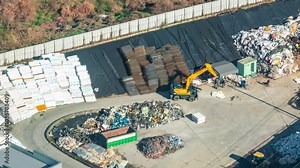 ASAN, SOUTH KOREA - OCTOBER 9, 2024: Overview of waste management facility operations with machinery sorting materials in South Korea