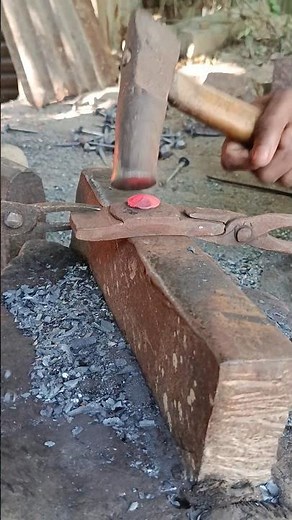 As iron is transformed into a nail by the strong #NailMakingArt #TraditionalForging #HammerAndFire