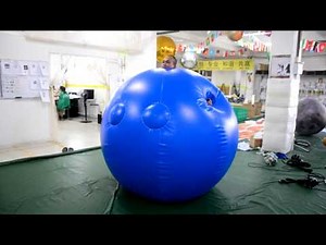 Inflatable ball suit