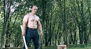 clip-23016946-strong-muscular-man-ax-chopping-wood-forest
