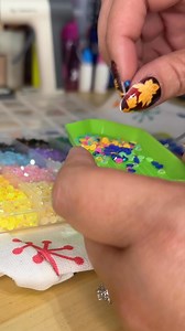 Yes of course I added rhinestones to my Christmas bag! It makes the lightbulbs look like they’re lit when the light hits them right! 🎄 #Christmas #Christmas2025 #purses #rhinestones #diy | Jennifer Marceau