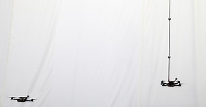 Quadrocopters throw, catch, and balance an inverted pendulum